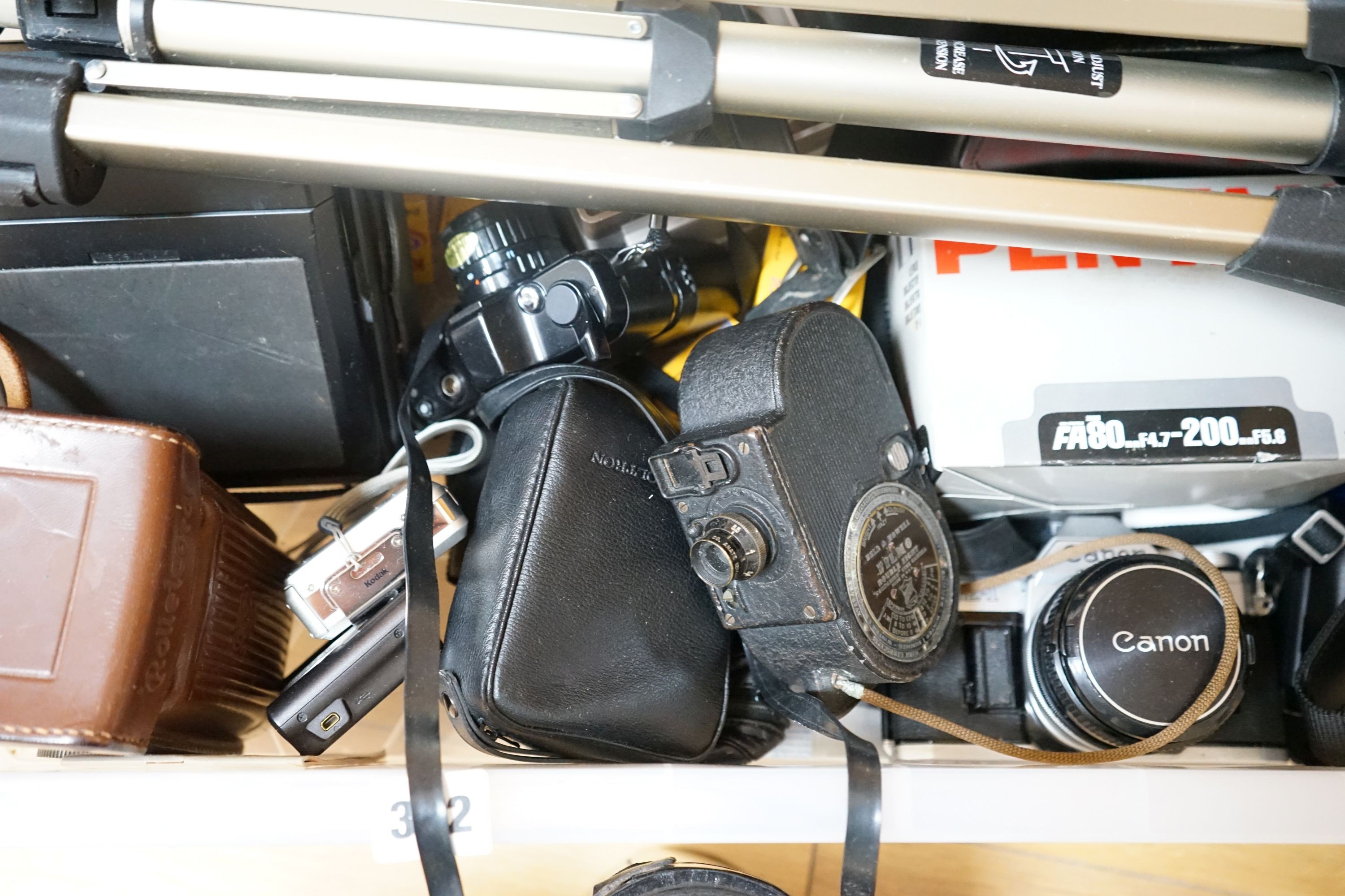 A collection of cameras and camera equipment